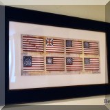 A09. Framed American flags print. 